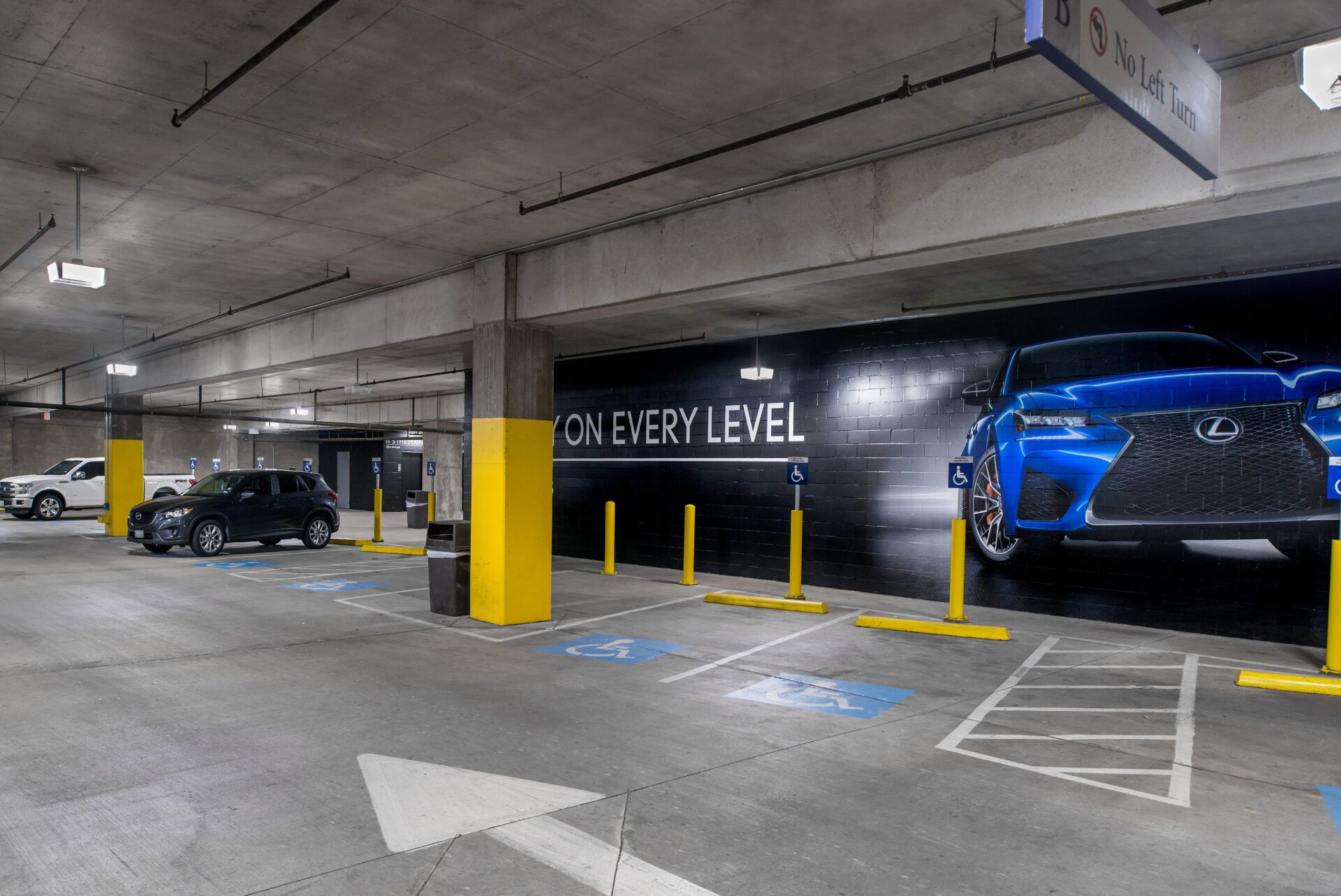 A parking structure well lit with LED parking garage lights