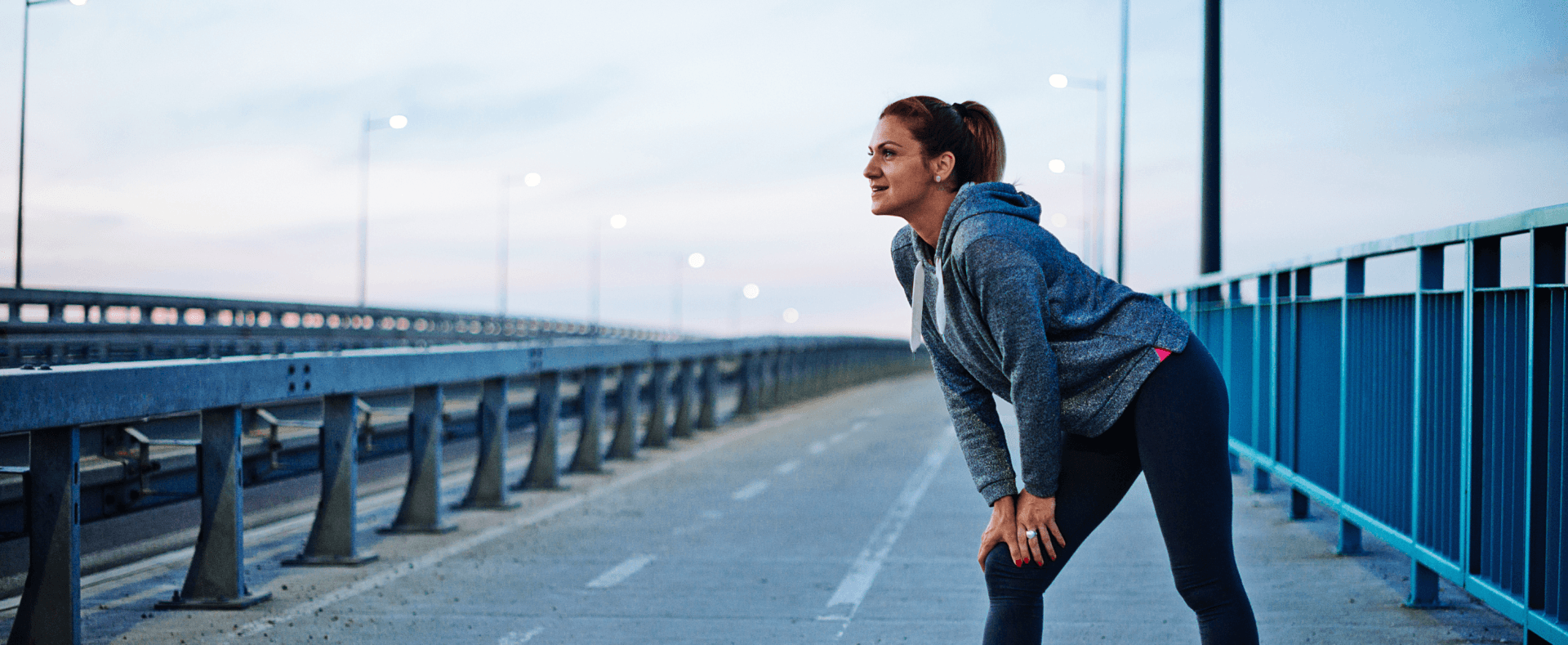 woman about to run on a bridge