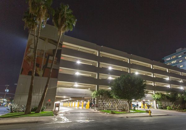 The U-Haul corporate office in Phoenix from the outside shown with bright parking garage lighting