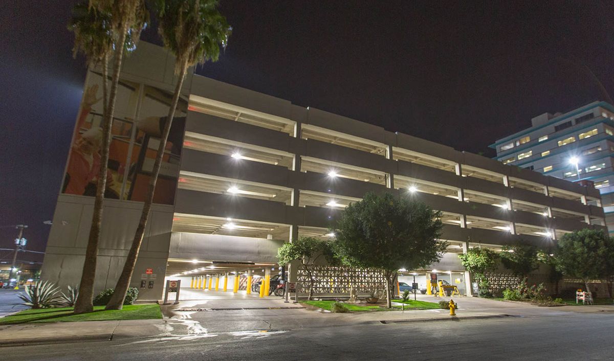 The U-Haul corporate office in Phoenix from the outside shown with bright parking garage lighting