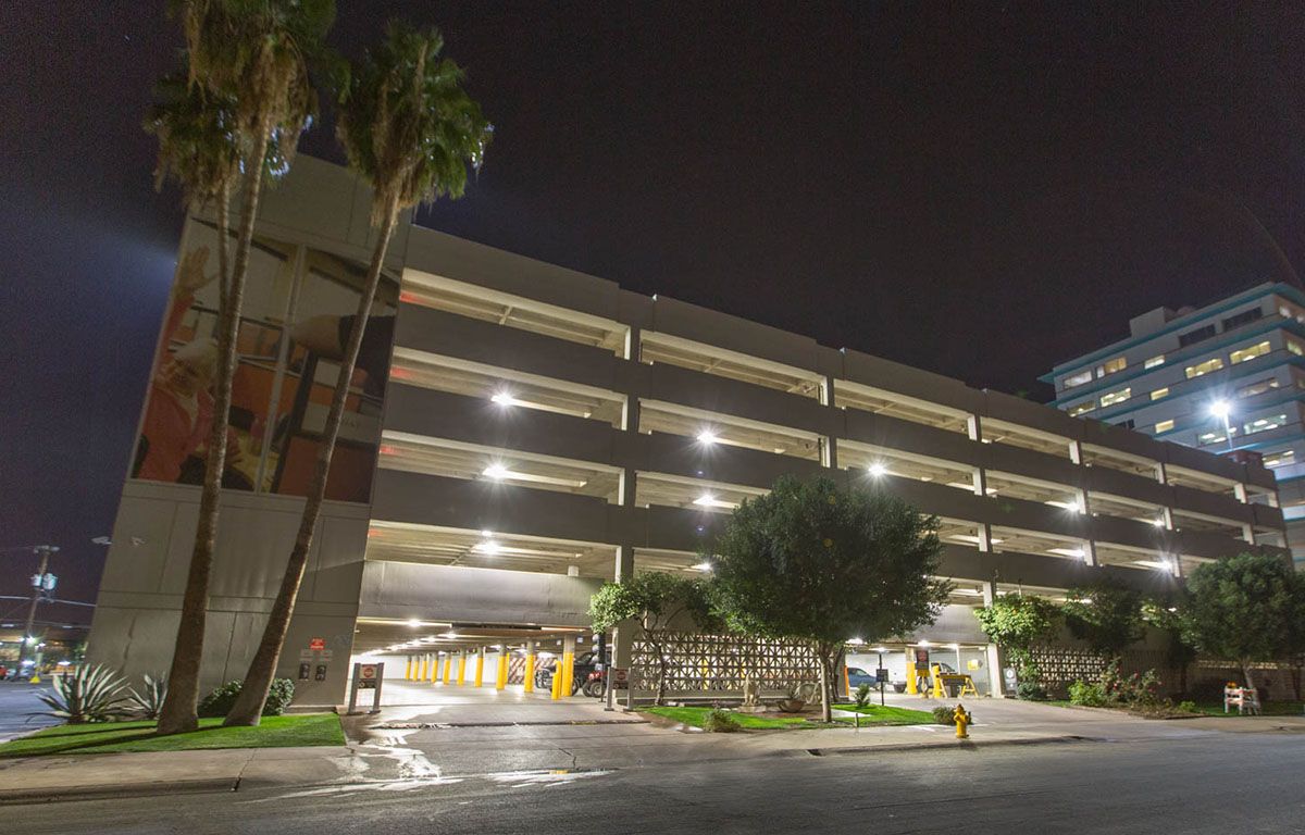 The U-Haul corporate office in Phoenix from the outside shown with bright parking garage lighting
